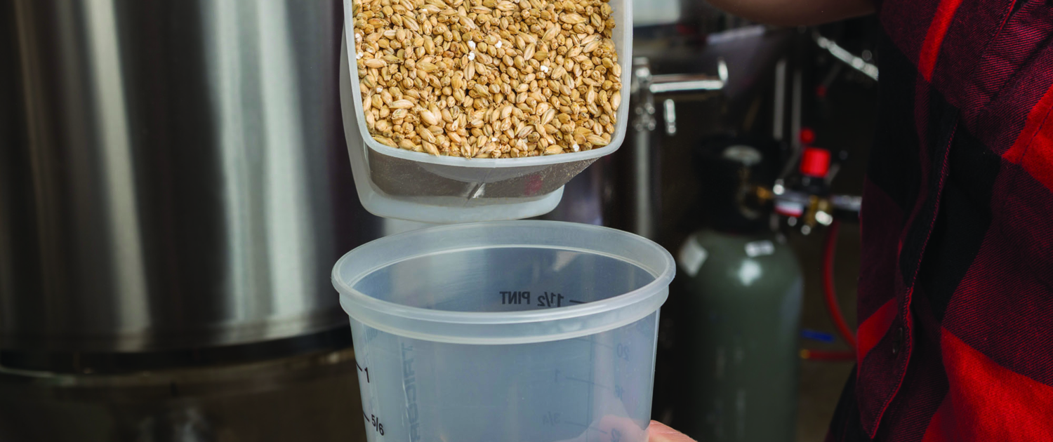 Barley being poured into measuring container