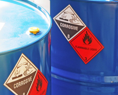 Close-up of a blue flammable liquid container